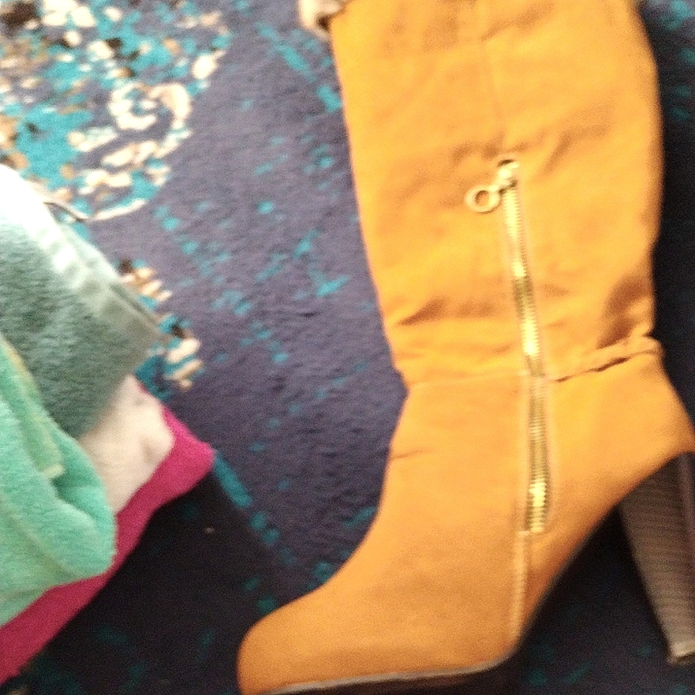 4 in heel 20 in tall man-made swade & fur looking boots